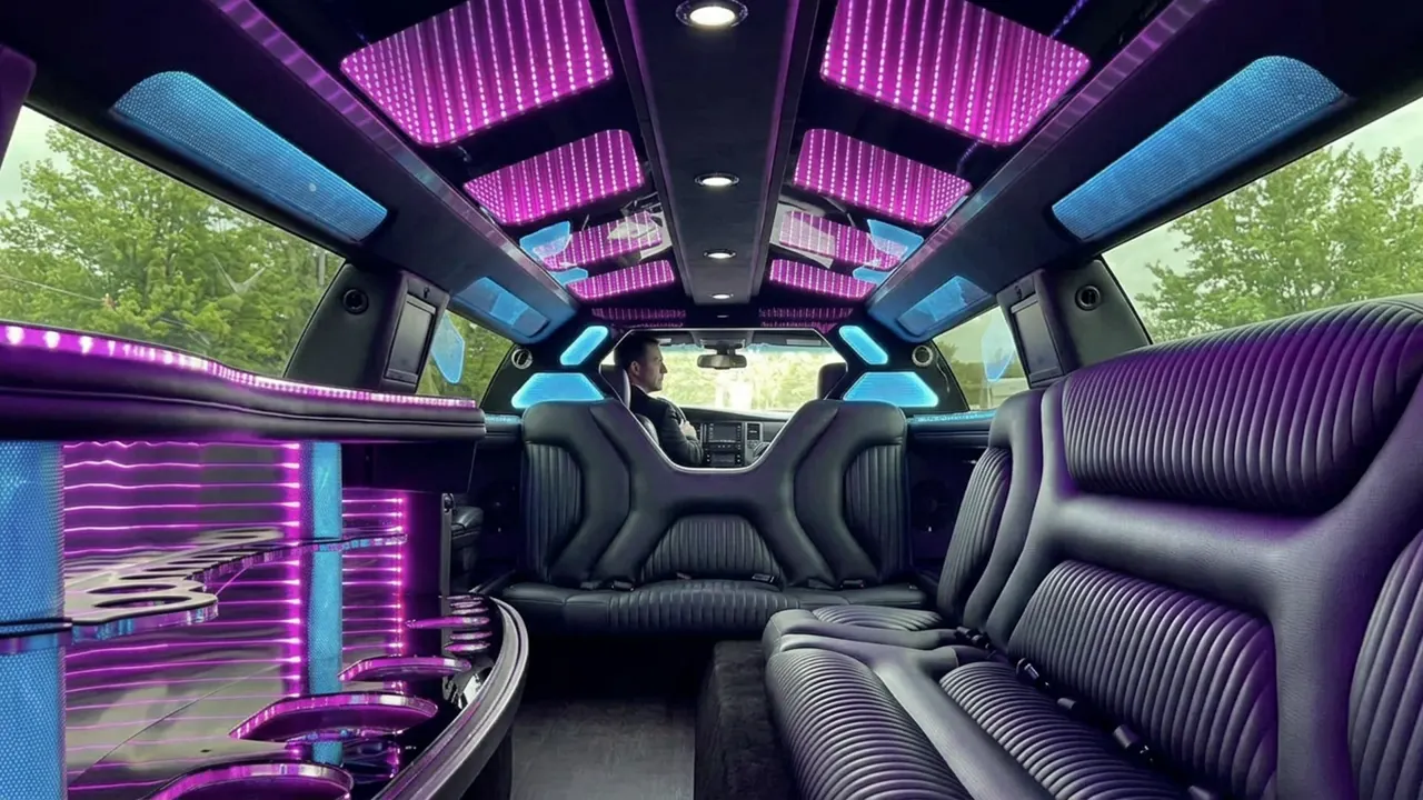 Dodge Charger stretch limo interior with color-changing lights and wrap-around leather seating